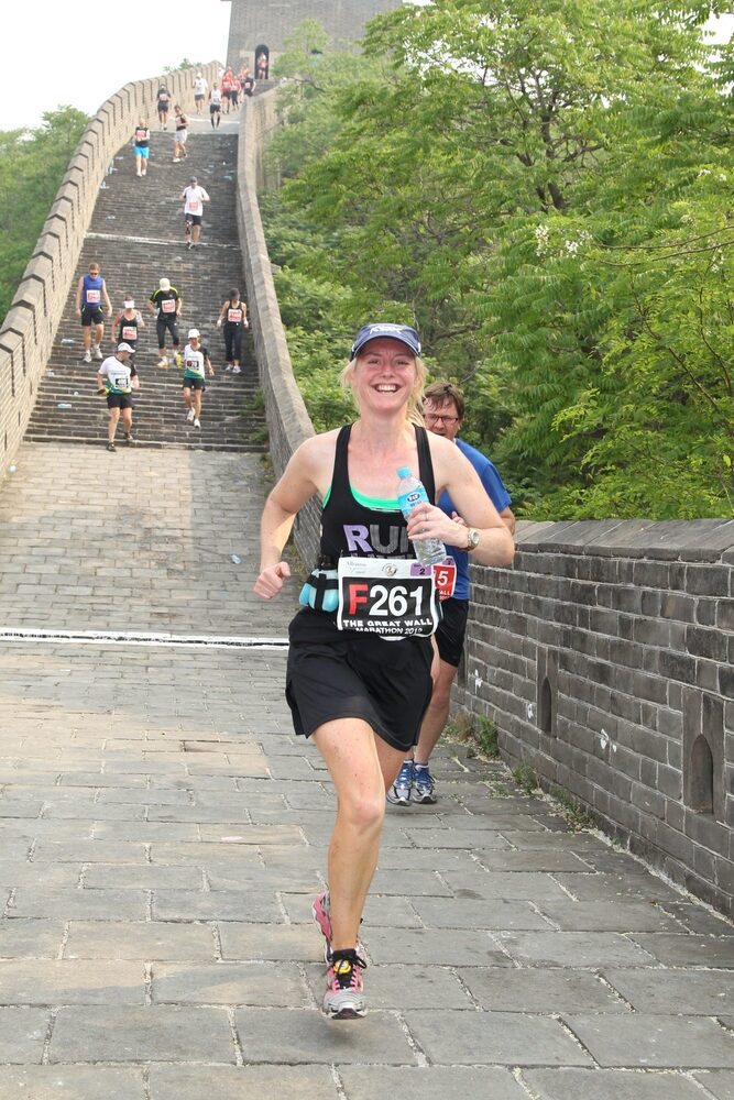 Michelle smiling as she runs the Great Wall Marathon in China